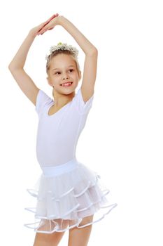 Little girl gymnast in a beautiful sports swimsuit for competitions, close-up. The concept of sport and fitness, a happy childhood. Isolated on white background.