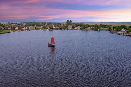 Aerial from the village Oudega in the Netherlands at sunset