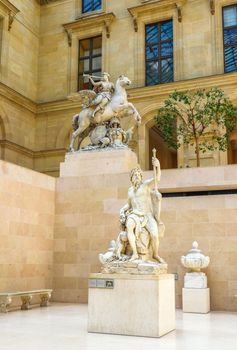 Paris / France - April 04 2019. Ancient sculpture in Cour Marly room inside the Louvre Museum, Paris, France, Europe