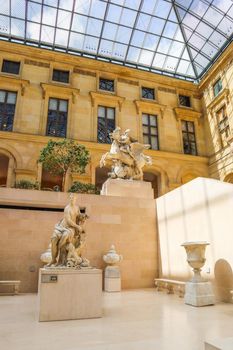 Paris / France - April 04 2019. Ancient sculpture in Cour Marly room inside the Louvre Museum, Paris, France, Europe