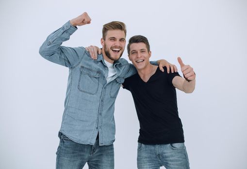 Portrait of two young people celebrating on a white background