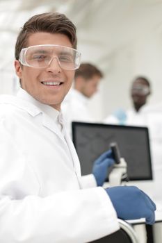 close up. scientist microbiologist at the laboratory table .science and technology