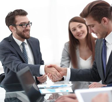 handshake of trading partners at the Desk.