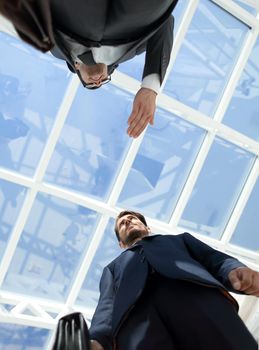 business meeting, handshake close up in office background