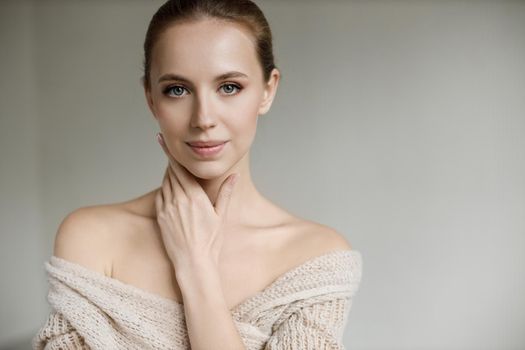 Portrait of a young pretty woman indoor in studio, skin wellness. High quality photo