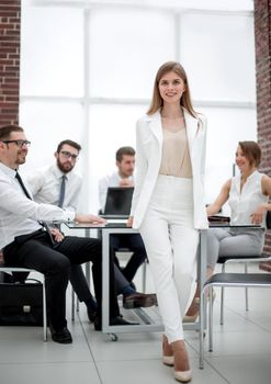 young business woman standing near desktop.photo with copy space