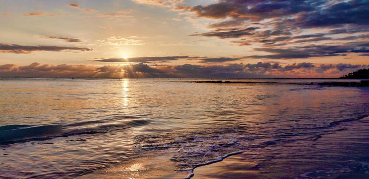 Warm, amazing sea wave close up on the beach sunrise like a sunset, nature landscape background.