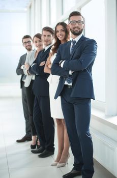 business team standing in the office.the concept of teamwork