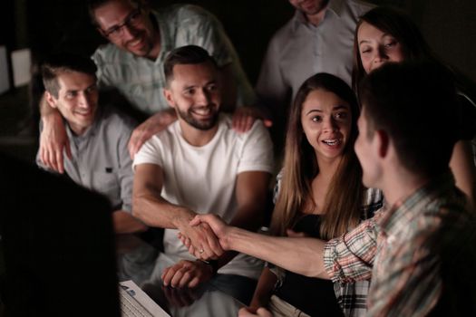 handshake of business people in the circle of colleagues.the concept of teamwork