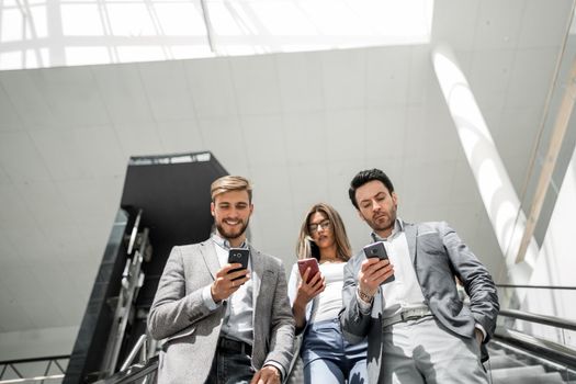 employees of the company standing on the escalator. people and technology