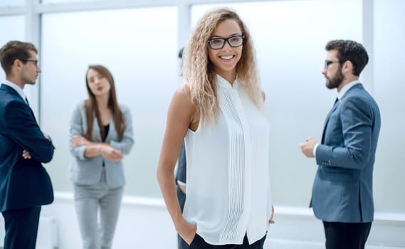 businesswoman and her colleagues standing in the office.business concept