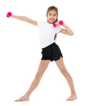 A cute little girl doing exercises with dumbbells. The concept of strength, health and sport. Isolated on white background.