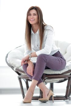 modern young young woman sitting in a comfortable chair. lifestyle