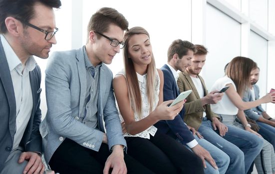 group of young people use their smartphones.the concept of communication