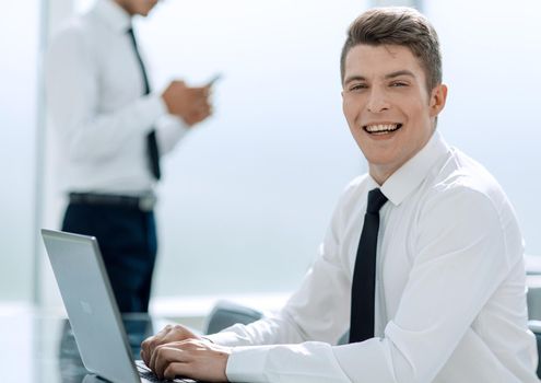 young employee working on a laptop in the office .people and technology