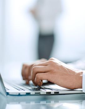 close up.businessman typing on a laptop.photo with copy space