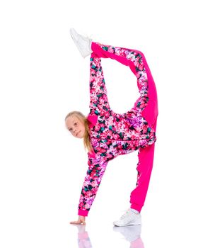 A girl gymnast performs an acrobatic element. The concept of childhood, sport, healthy lifestyle. Isolated on white background.