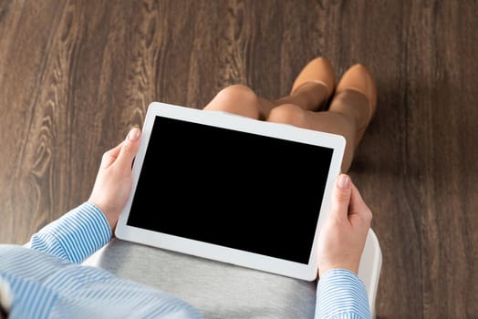 close-up of female hands with a computer tablet