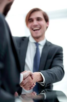 vertical photo.handshake business people .close up.