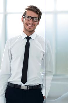 close up.young employee standing in the office.business people