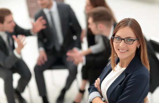successful young business woman on the background of the office.
