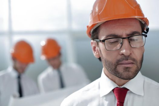 close up.portrait of confident architect on blurred background .business people