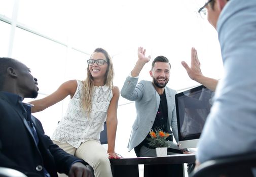 employees greet each other in the office.the concept of teamwork