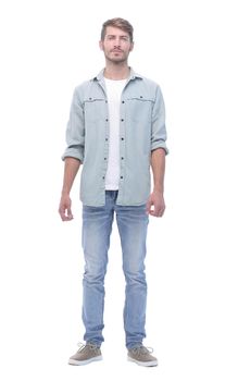 in full growth.handsome modern guy in jeans.isolated on white background