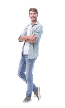 in full growth. smiling young man in jeans.isolated on white background