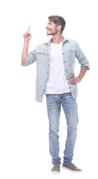 in full growth. successful young man showing on copy space.photo with text place