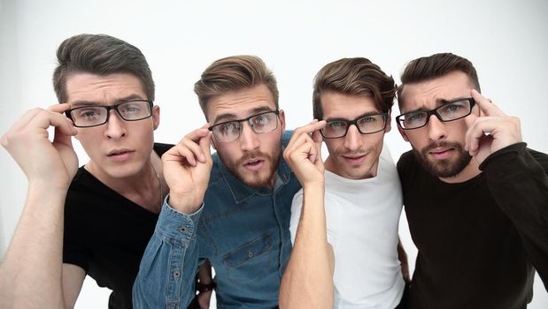 close up. a group of creative friends looking at you through glasses.stylized photo