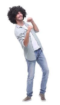 in full growth. portrait of a cheerful young man .isolated on white background