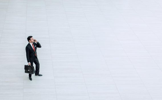 top view from afar.Businessman talking on a mobile phone. photo with copy space