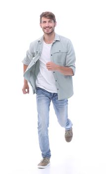 in full growth. a successful young man confidently steps forward.isolated on white background