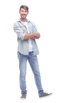 in full growth. smiling young man in jeans.isolated on white background