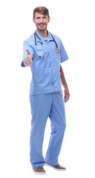 in full growth.a medical doctor with a stethoscope holding out his hand for a handshake.isolated on white background