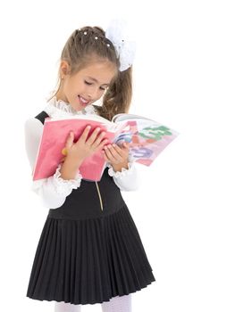 Little girl with book. The concept of education in school or kindergarten. Isolated over white background