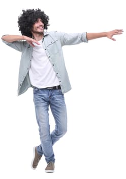 in full growth. stylish young man pointing to copy space .isolated on white background