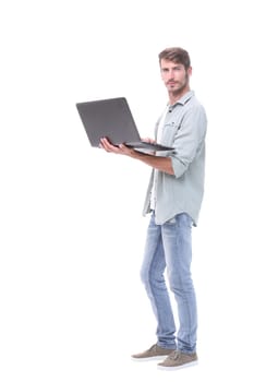 in full growth.successful young man with a laptop .isolated on white background