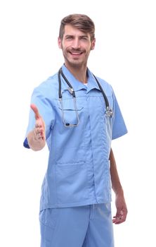 in full growth.a medical doctor with a stethoscope holding out his hand for a handshake.isolated on white background