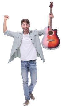 in full growth.happy young male musician with guitar.isolated on white background