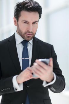 businessman reading text message on smartphone.people and technology