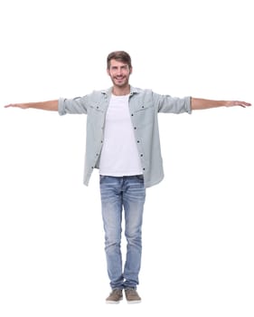 in full growth.the young man holding out his hands forward .isolated on white background