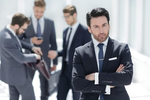 confident businessman standing in the office.photo with copy space