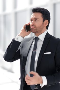 responsible businessman talking on a mobile phone.people and technology