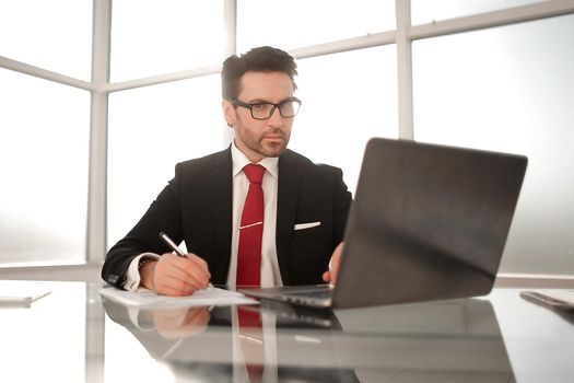 close up.businessman sitting at his Desk.business concept