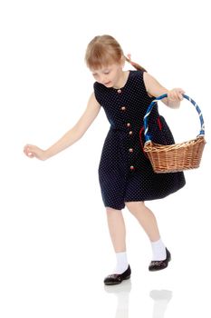 A little girl with a wicker basket made of willow twigs. The concept of family rest, harvesting, picking mushrooms and berries. Isolated over white background