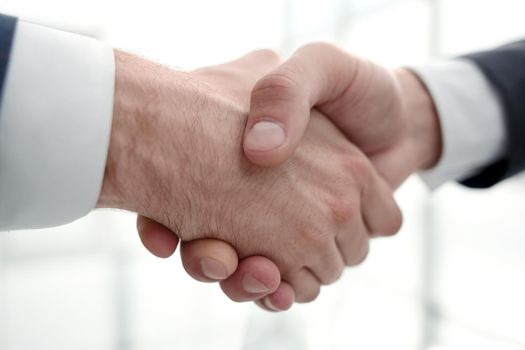 close up.handshake business partners.concept of partnership