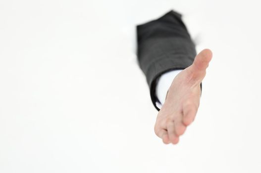 businessman holding out his hand for a handshake . photo with copy space