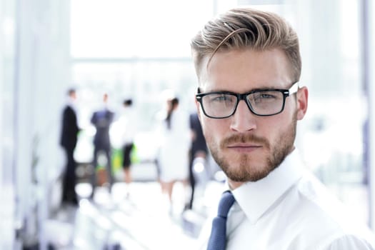 close up.portrait of a successful businessman on the background of the office